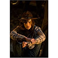 The Walking Dead Chandler Riggs as Carl sitting with arms around knees 8 x 10 Inch Photo