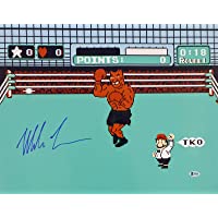 Mike Tyson Autographed 16x20 Photo Punch-Out In Blue Beckett BAS Stock #159679